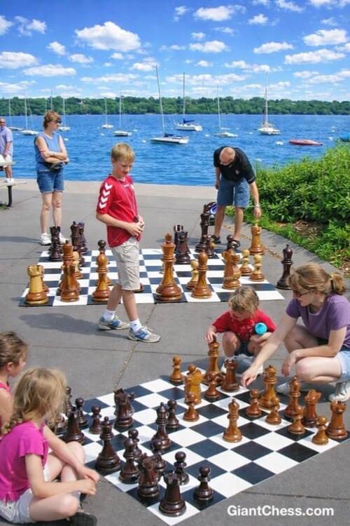 Giant teak chess set photo