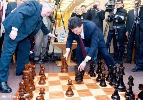Giant teak chess set photo