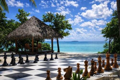 Giant teak chess set photo