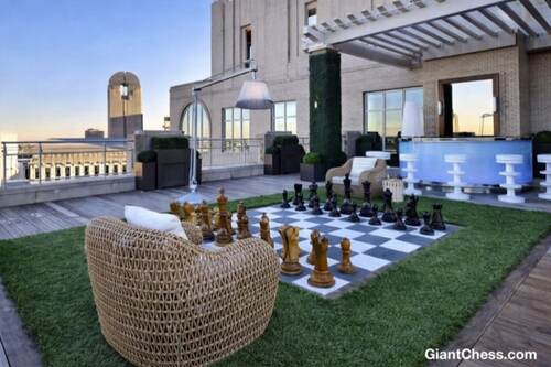 Giant teak chess set photo