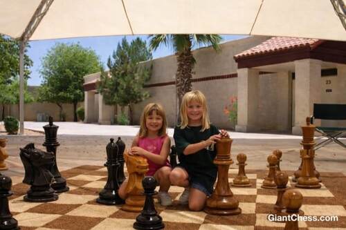 Giant teak chess set photo