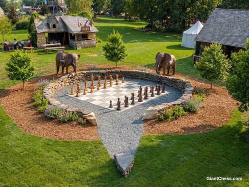 Giant teak chess set photo