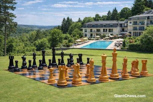 Giant teak chess set photo