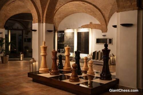 Giant teak chess set photo