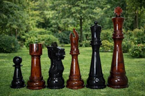 Giant teak chess set photo