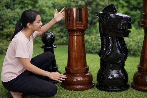 Giant teak chess set photo