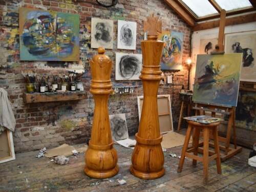 Giant teak chess set photo