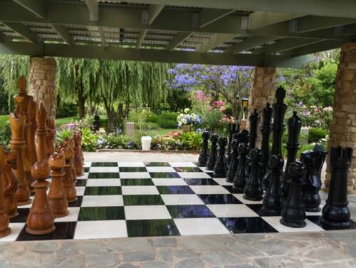 Giant teak chess set photo