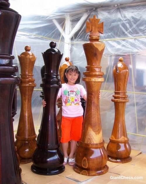 Giant teak chess set photo