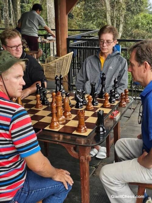 Giant teak chess set photo
